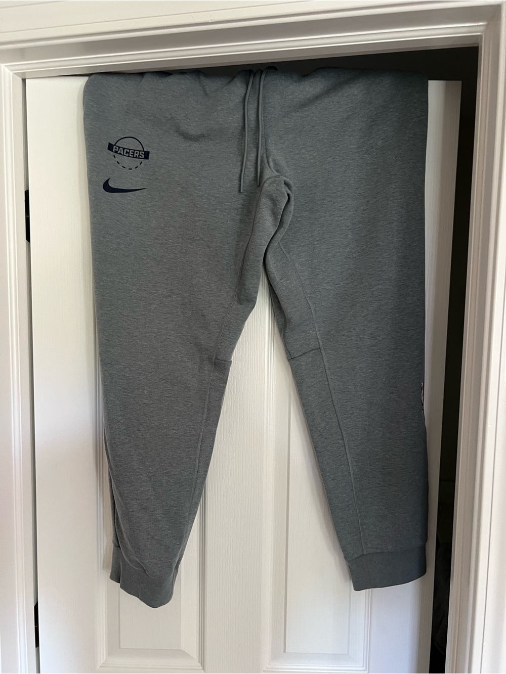 Nike Mens Gray Pacers Logo Jogger Sweatpants. Authentic NBA apparel.